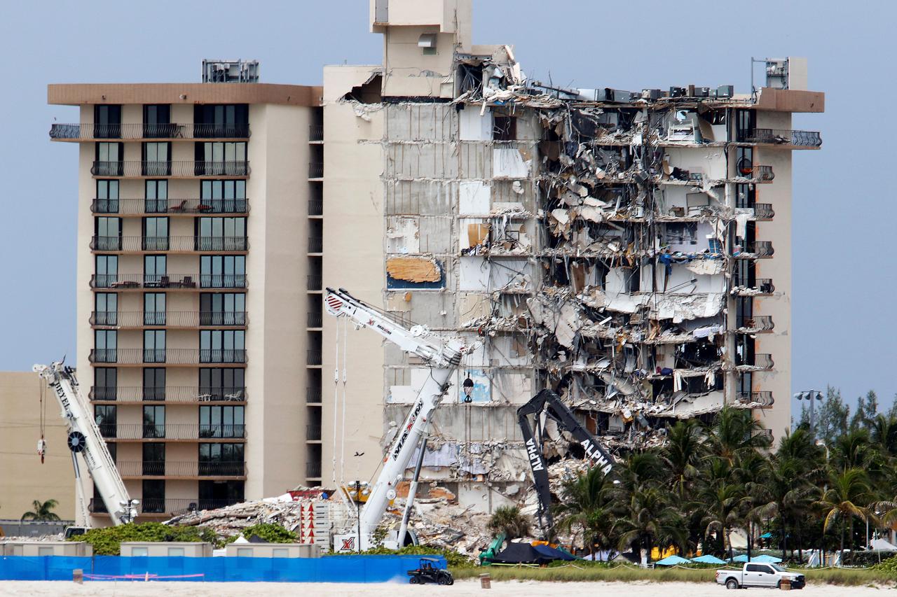 Rescue efforts are halted at the site of a partially collapsed residential building in Surfside