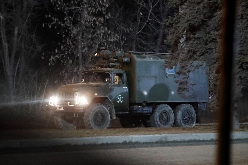 A military vehicle is seen on a street on the outskirts of Donetsk