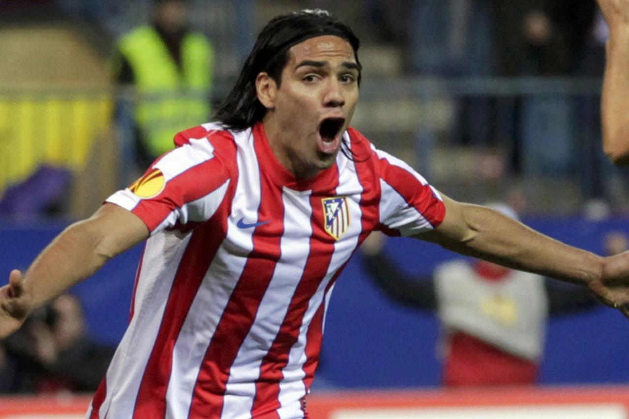 'Atletico Madrid\'s Radamel Falcao celebrates after scoring a goal against Valencia during his Europa League semi-final first leg soccer match at Vicente Calderon stadium in Madrid April 19, 2012.    