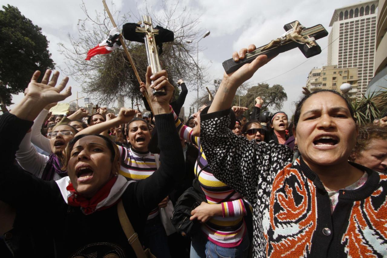 'Egyptian Coptic Christians demonstrate outside the state radio and television building in central Cairo on March 8, 2011, to protest the burning of a church last week after deadly clashes between Chr