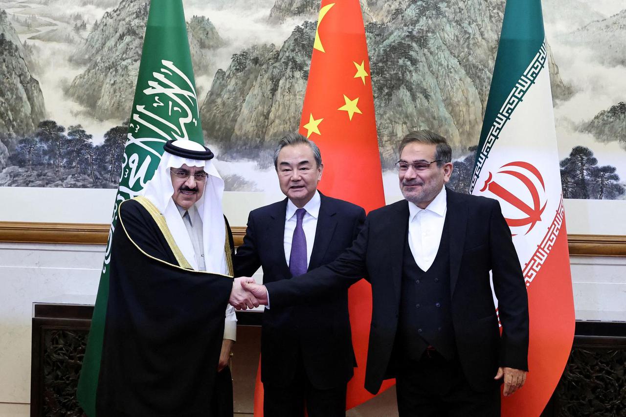 FILE PHOTO: China's director of the Office of the Central Foreign Affairs Commission Wang Yi, Ali Shamkhani, the secretary of Iran’s Supreme National Security Council and Saudi national security adviser  Musaad bin Mohammed Al Aiban meet in Beijing