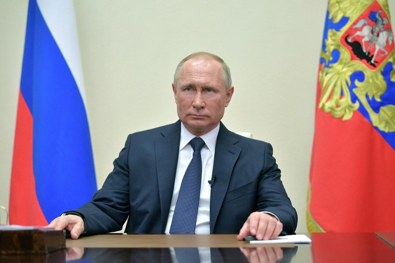 Russian President Putin delivers a televised address to the nation about the coronavirus disease outbreak, outside Moscow