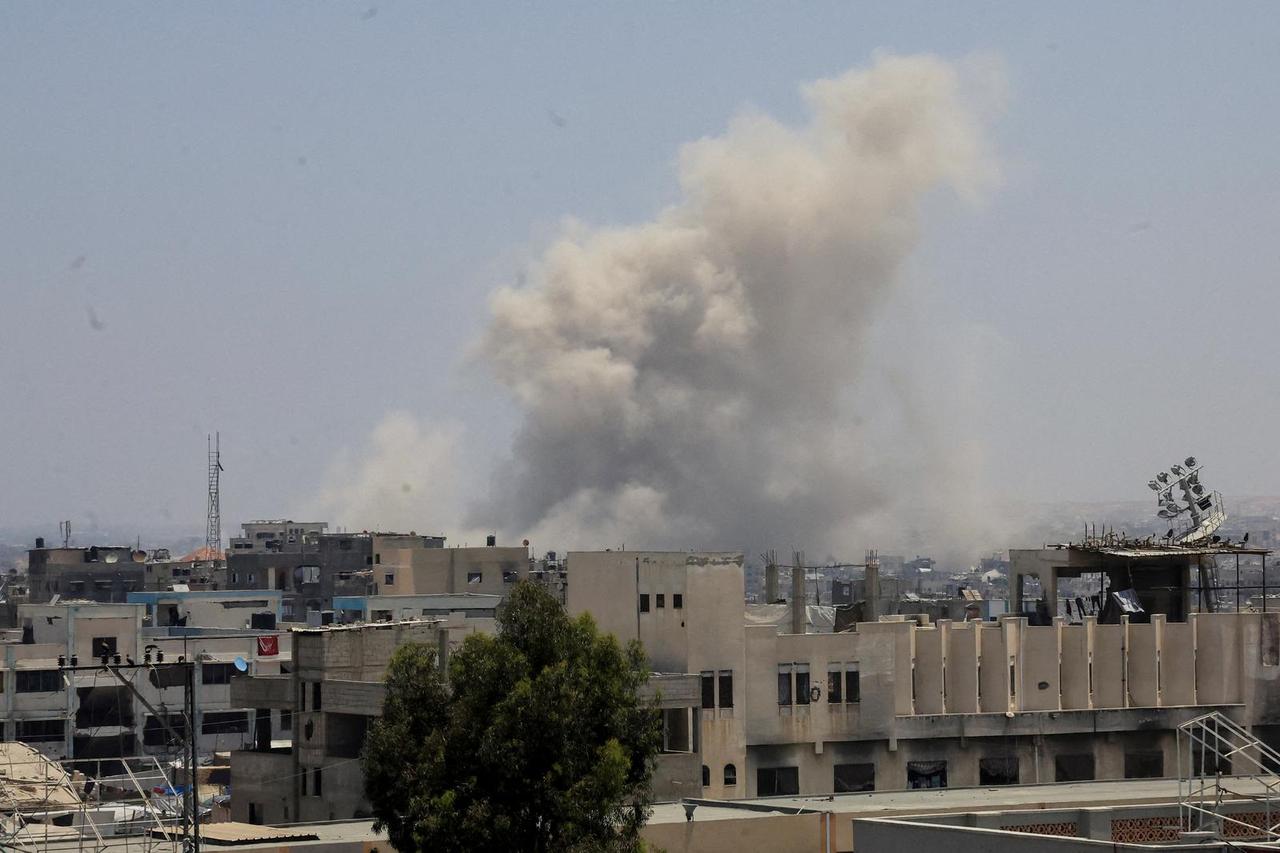 Smoke rises following Israeli strikes, in Khan Younis