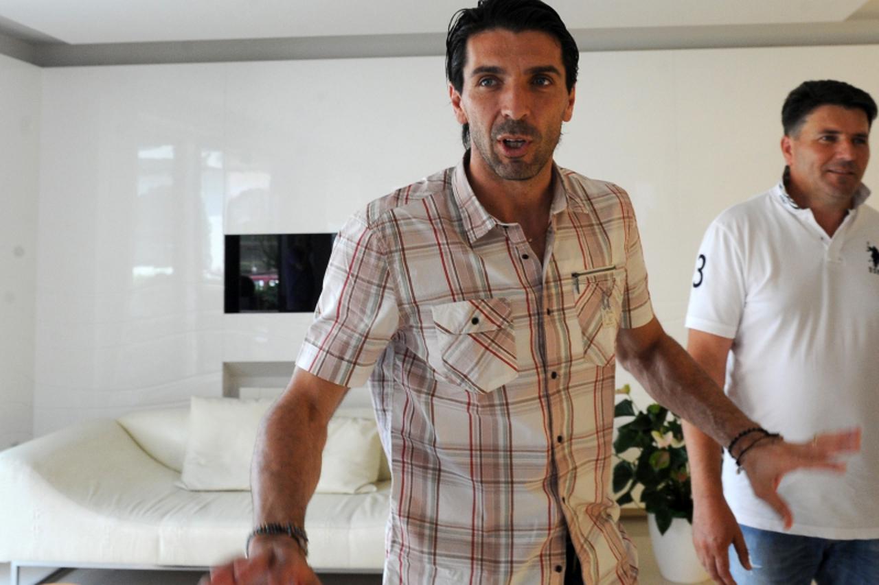 'Italian national football team goalkeeper and captain Gianluigi Buffon stands in the lobby of a hotel in the southern Bosnian town of Medjugorje on July 4, 2012. Buffon visited Medjugorje, a world kn