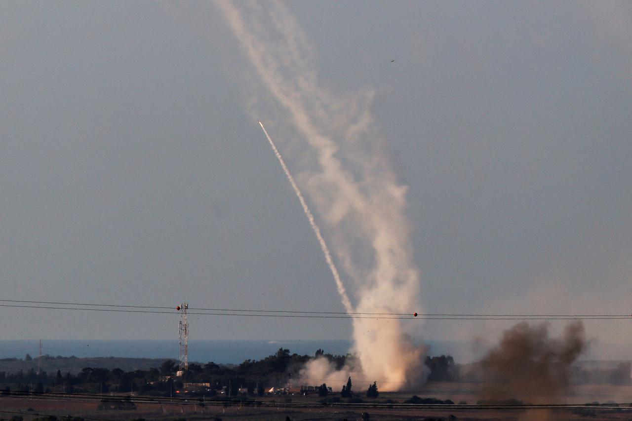 Israel's Iron Dome anti-missile system launches defensive rockets to intercept rockets launched from the Gaza Strip towards Israel, as seen from near Sderot