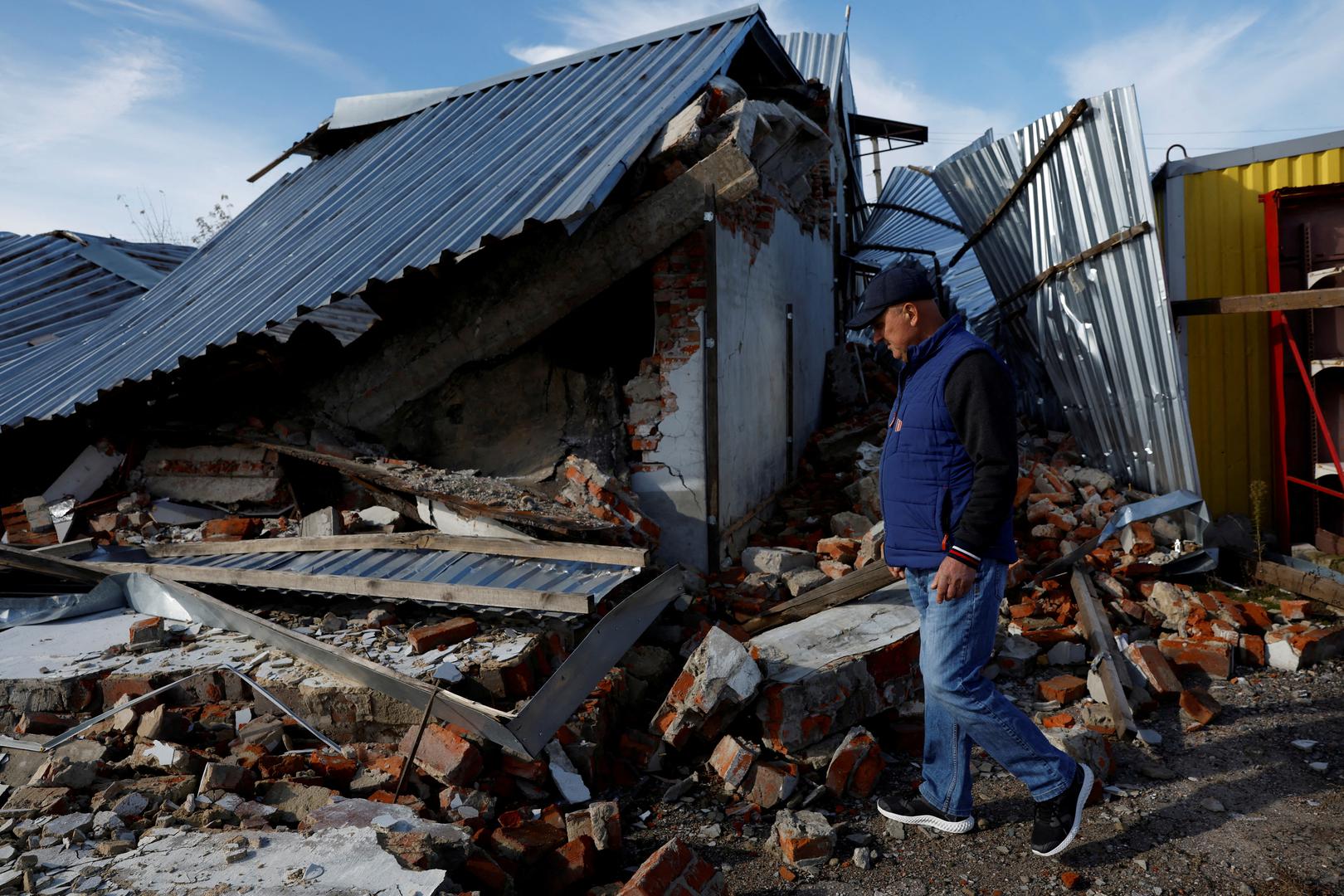 Victor walks across the forecourt of his garage which was completely destroyed during Russian strikes, amid Russia's attack on Ukraine, in Balakliia, Ukraine, October 22, 2022. REUTERS/Clodagh Kilcoyne     TPX IMAGES OF THE DAY Photo: Clodagh Kilcoyne/REUTERS