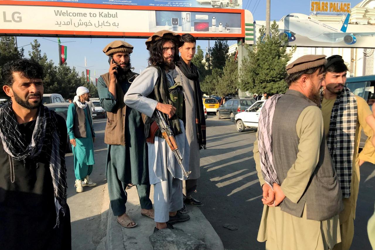 A member of Taliban stands outside Hamid Karzai International Airport in Kabul