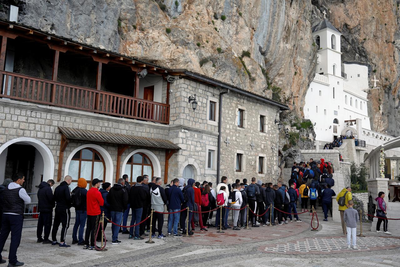 Pilgrims walk to the medieval monastery of Ostrog and challenge coronavirus restrictions, in Niksic