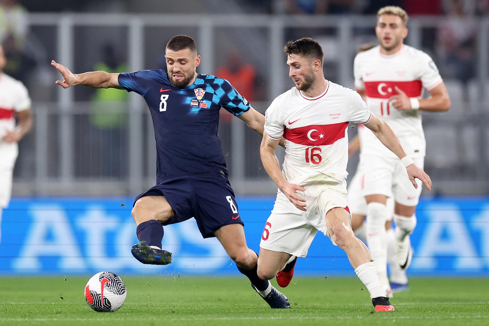 12.10.2023., Opus Arena, Osijek - Kvalifikacije za UEFA Europsko prvenstvo 2024., skupina D, 7. kolo, Hrvatska - Turska. Mateo Kovacic, Ismail Yuksek Photo: Igor Kralj/PIXSELL