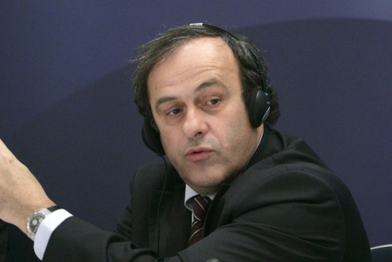 'UEFA President Michel Platini gestures to the media during a news conference after an UEFA Executive Committee meeting in Luzerne November 30, 2007. The Champions League final will be moved from its 