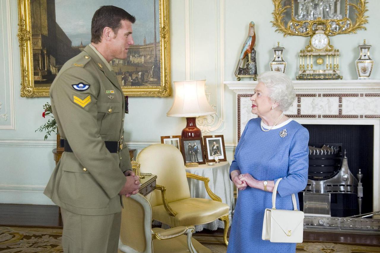FILE PHOTO: Britain's Queen Elizabeth II greets Australian SAS Corporal Ben Roberts-Smith, who was recently awarded the VC, during an audience at Buckingham Palace in London