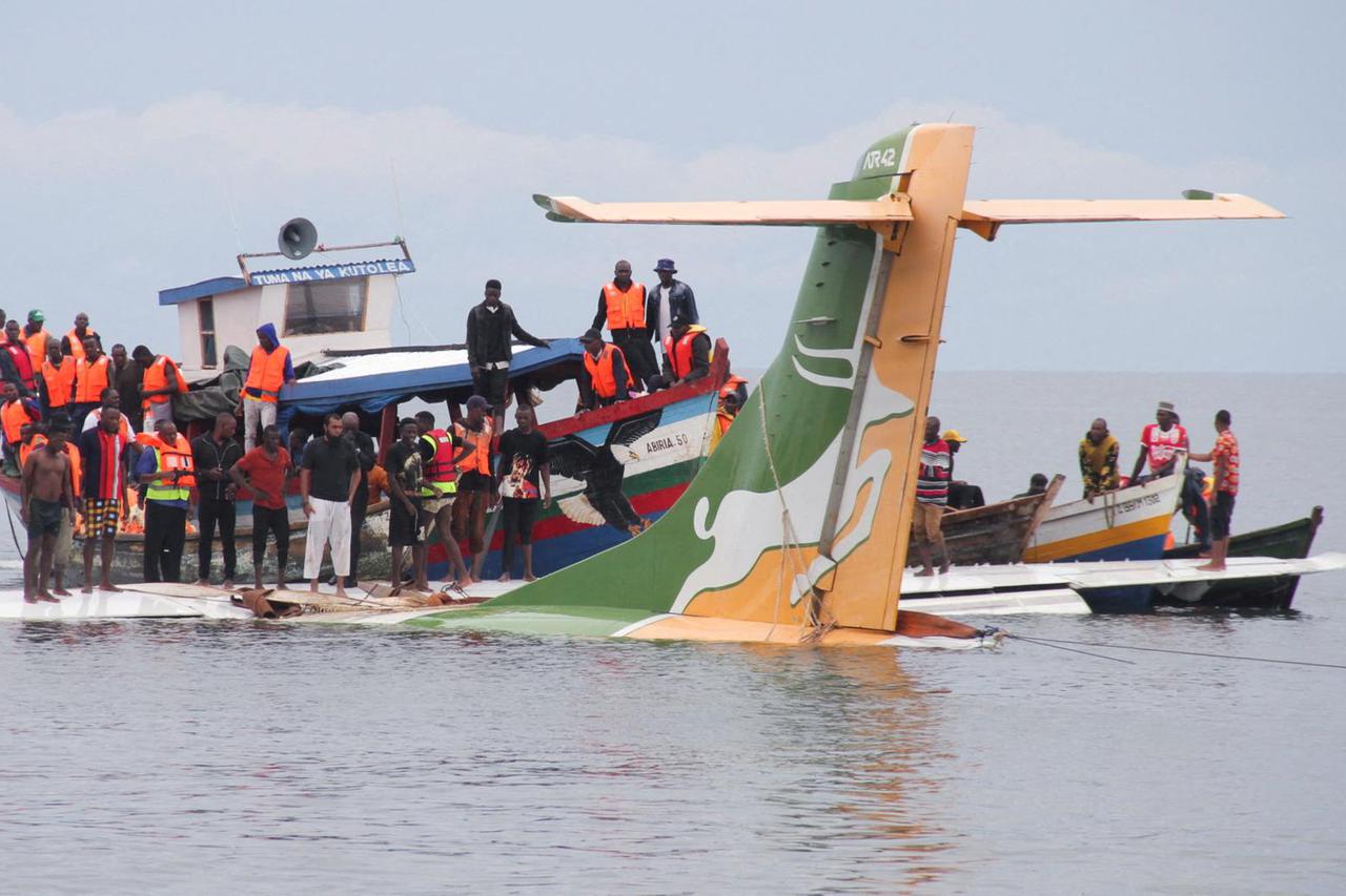 Rescuers attempt to recover the Precision Air passenger plane that crashed into Lake Victoria in Bukoba
