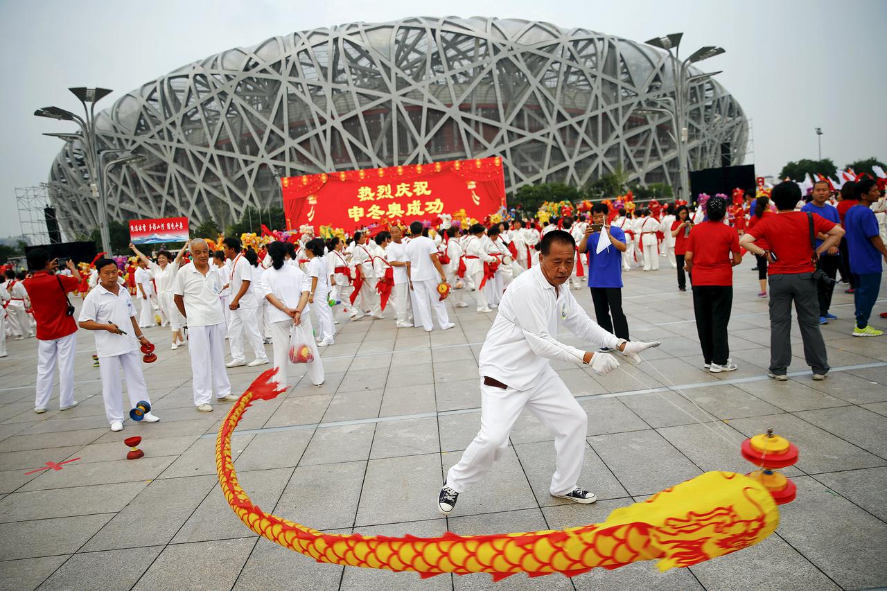 People celebrate after Beijing was chosen to host the 2022 Winter Olympics at the Bird's Nest Olympic stadium in Beijing July 31, 2015. Beijing was chosen by the International Olympic Committee (IOC) to host the 2022 Winter Olympics on Friday, becoming th