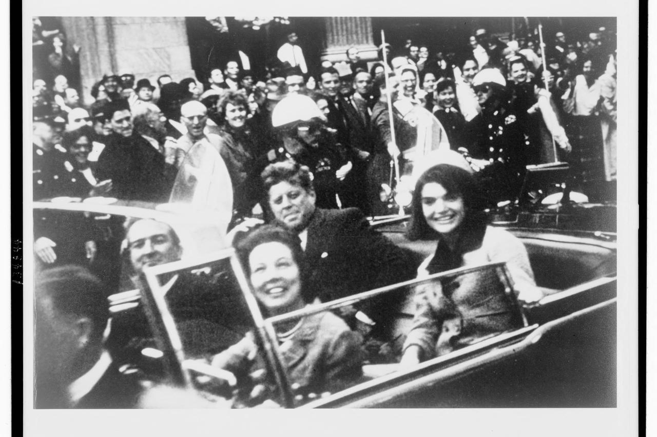 FILE PHOTO: File handout image shows former U.S. President Kennedy and first lady Jacqueline Kennedy riding in motorcade in Dallas