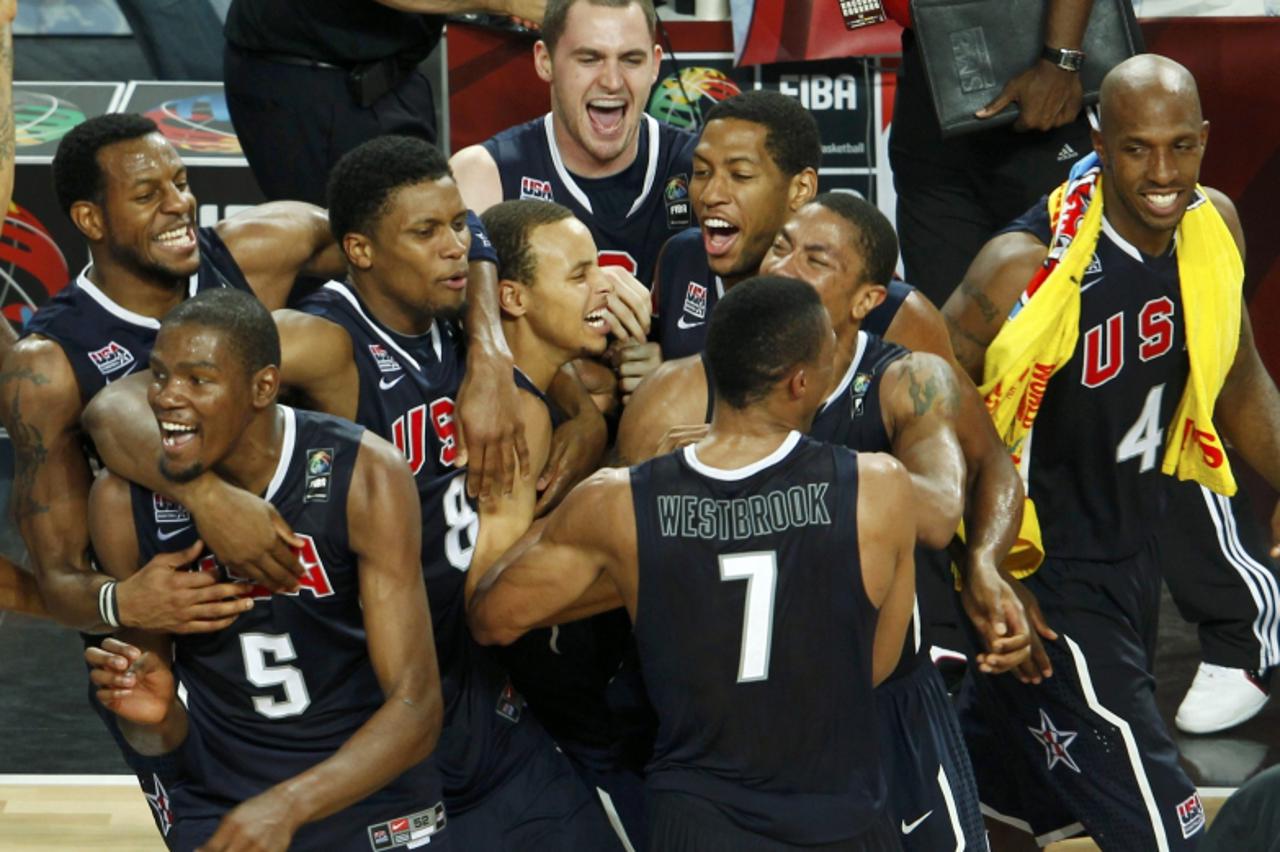 \'U.S. players celebrate their victory against Turkey after their FIBA Basketball World Championship final game in Istanbul, September 12, 2010.  REUTERS/Sergio Perez (TURKEY  - Tags: SPORT BASKETBALL