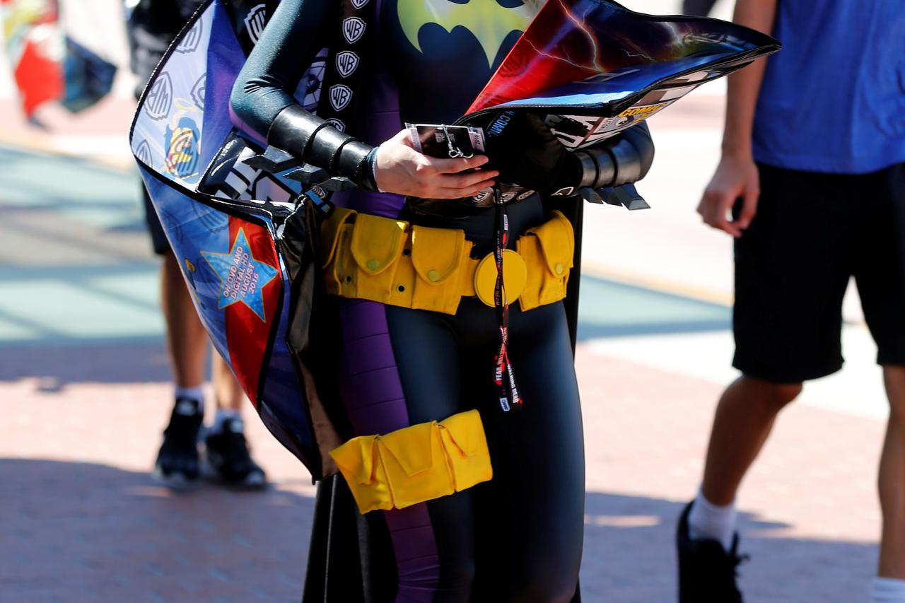 An attendee dressed as Bat Girl arrives for the start of Comic-Con International in San Diego, California, United States, July 20, 2016. REUTERS/Mike Blake