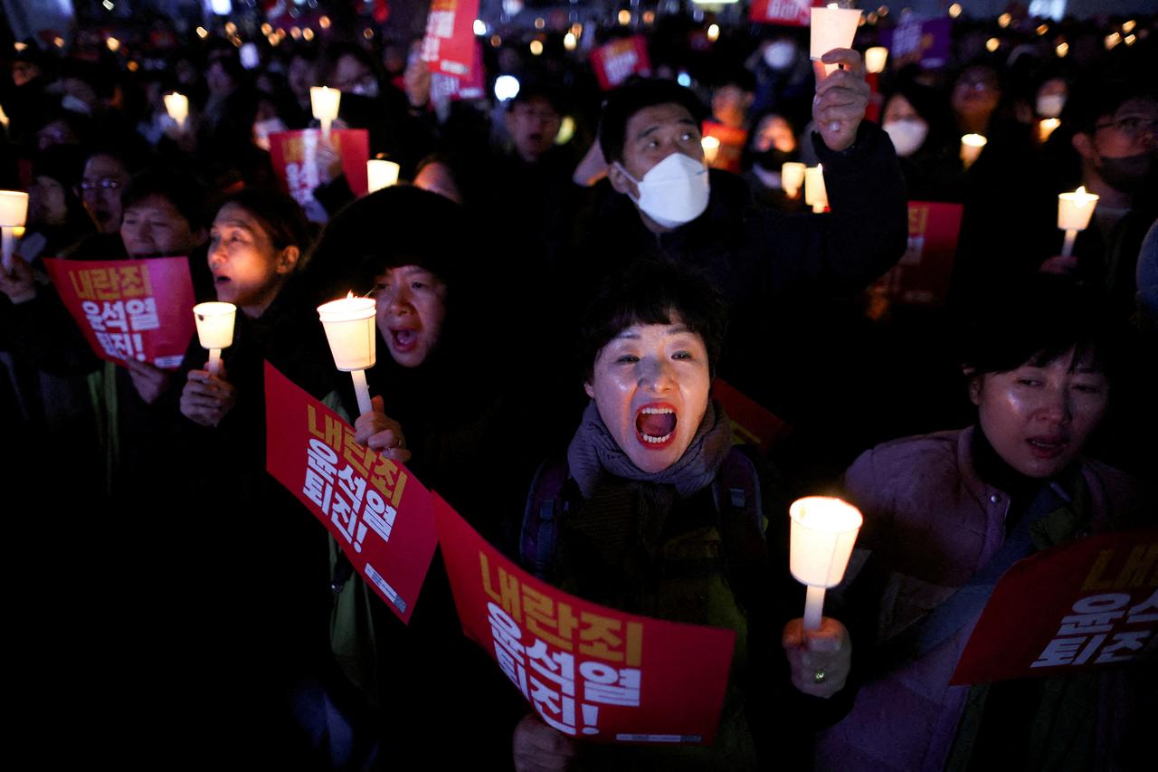Soldiers advance to the main building of the National Assembly after South Korean President Yoon Suk Yeol declared martial law in Seoul
