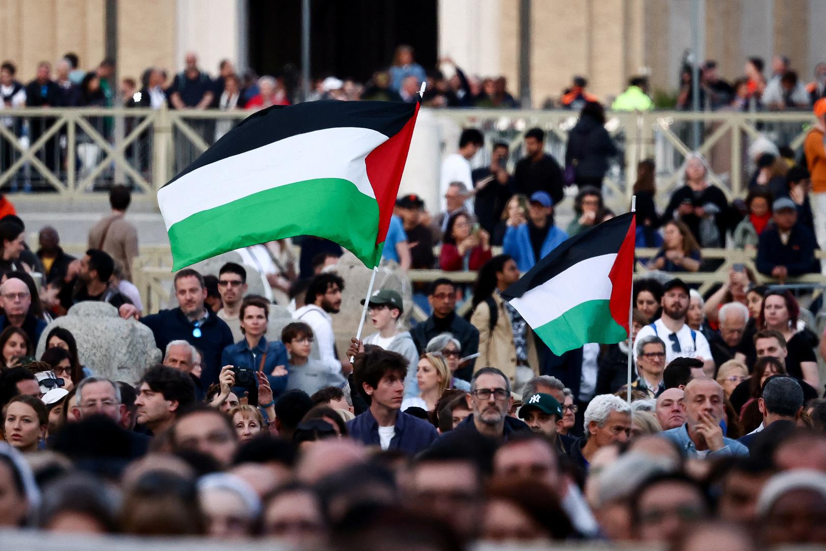 People hold Palestinian flags during a rosary for Pope Francis, following the death of the pontiff, in St. Peter's square, at the Vatican, April 21, 2025. REUTERS/Yara Nardi Photo: YARA NARDI/REUTERS