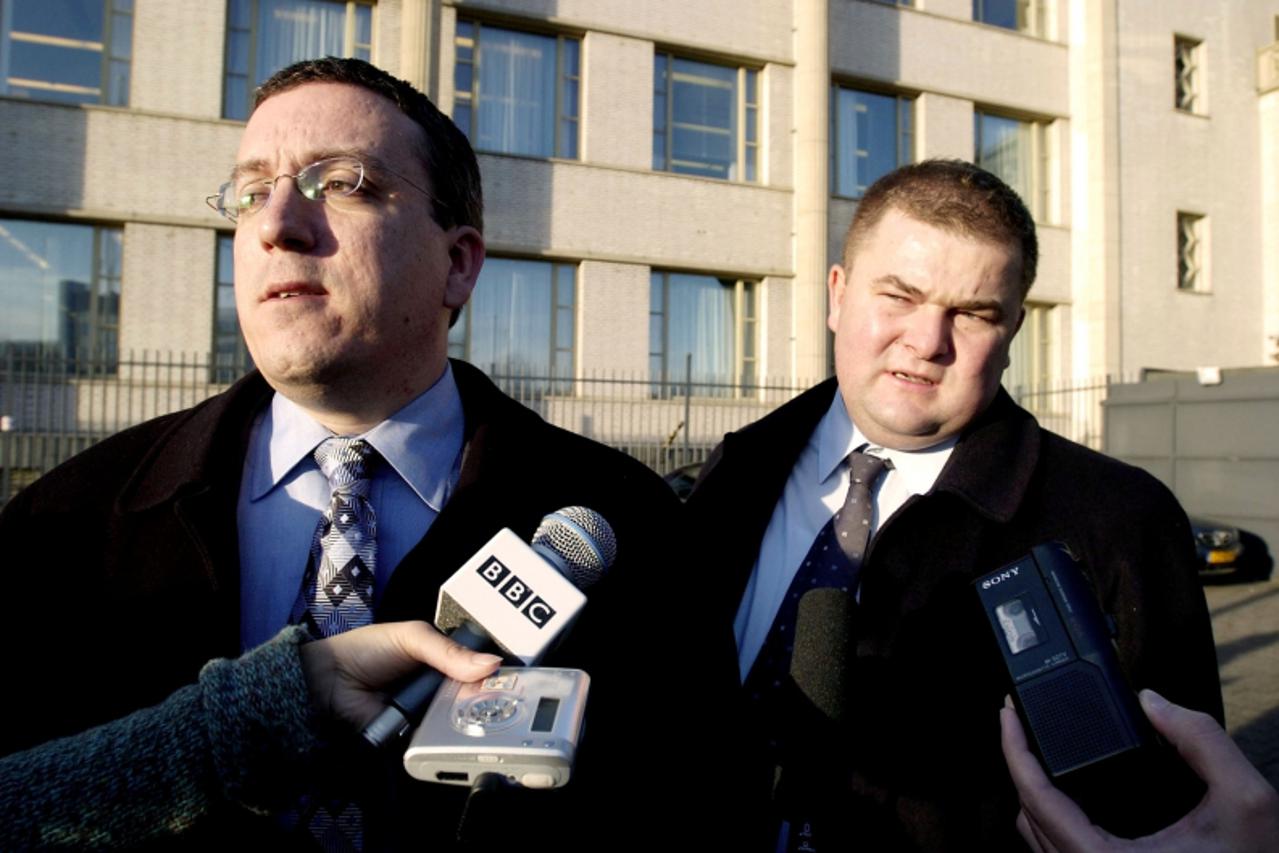 'Croatian lawyers Luka Misetic (L) and Marin Ivani (R) speak to reporters after visiting General Ante Gotovina at the U.N. war crimes tribunal for his initial appearance in The Hague, the Netherlands 