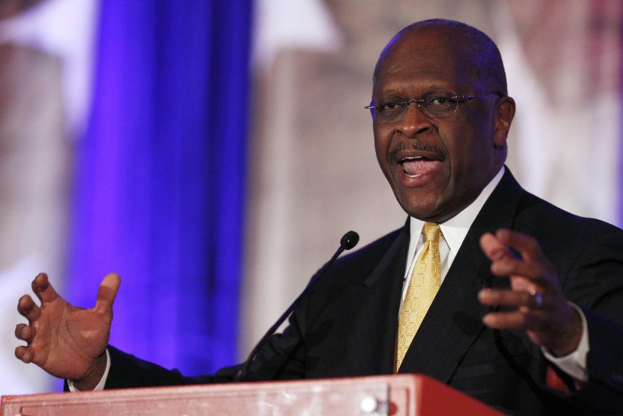 'Republican presidential candidate Herman Cain, former chairman of Godfather\'s Pizza, delivers remarks during the Faith and Freedom Coalition\'s second annual conference and strategy briefing in Wash