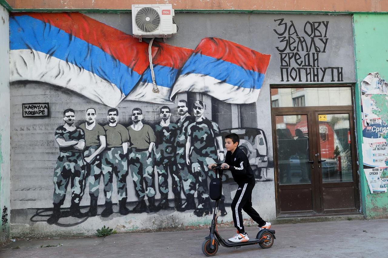 An ethnic Serb uses his scooter in North Mitrovica