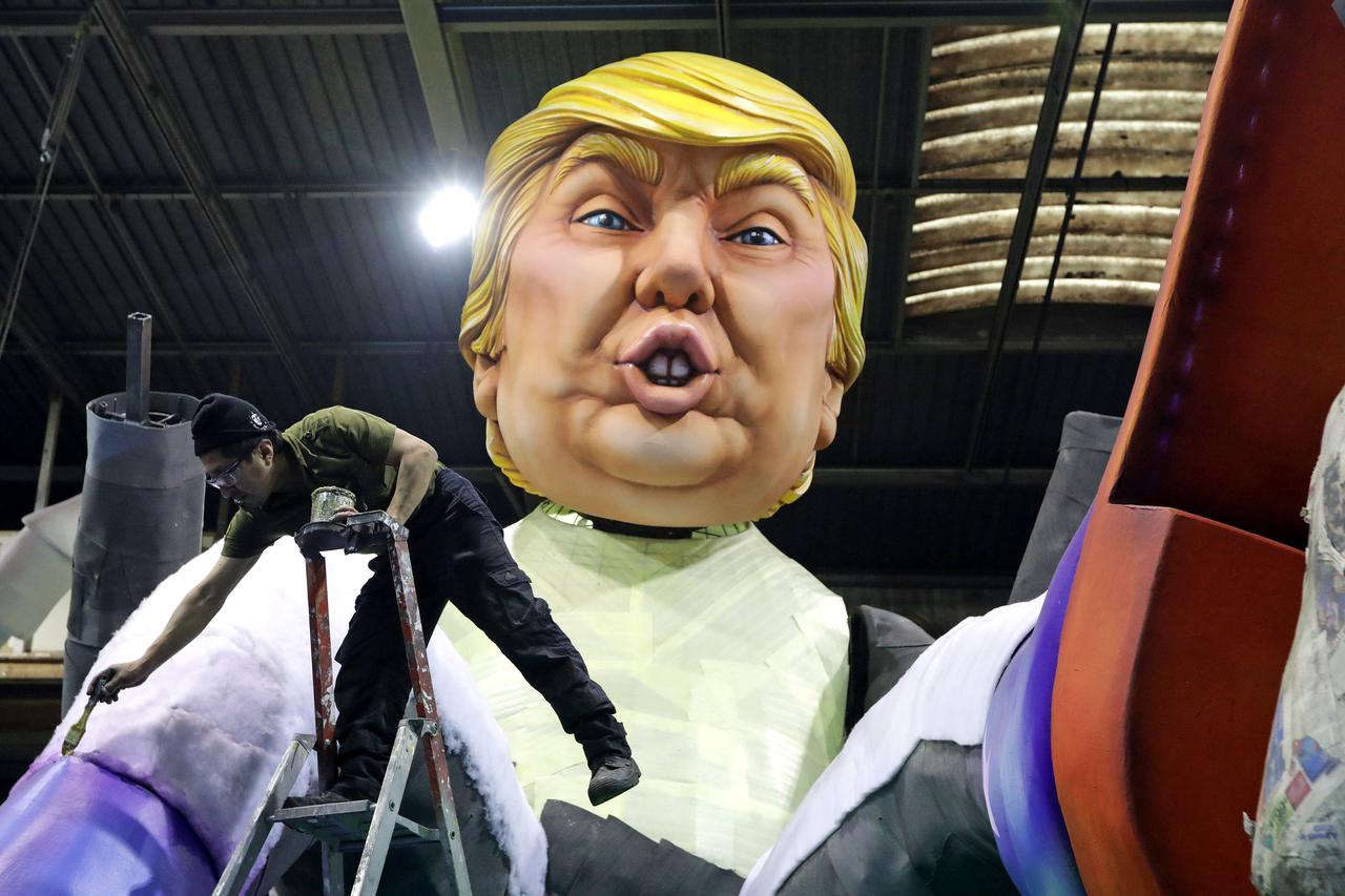 A worker is seen next to a giant figure of U.S. President Donald Trump during preparations for the carnival parade in Nice, France, January 26, 2017.     REUTERS/Eric Gaillard