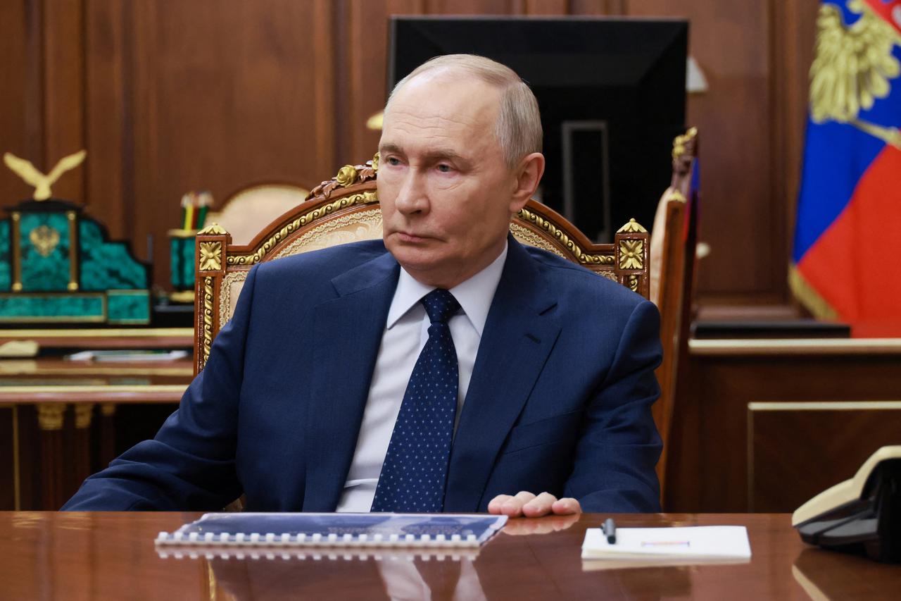 Russian President Vladimir Putin meets with First Deputy Prime Minister Denis Manturov in Moscow