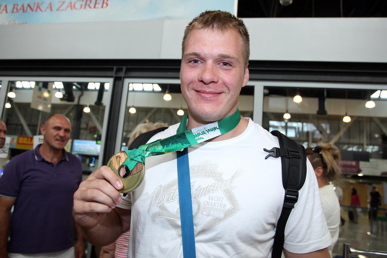 29.07.2014., Zagreb - Docek u Zracnoj luci Zagreb Martina Markovica, juniorskog prvaka svijeta u bacanju diska, i Sare Kolak, osvajacice broncane medalje u bacanju koplja.  Photo: Goran Jakus/PIXSELL