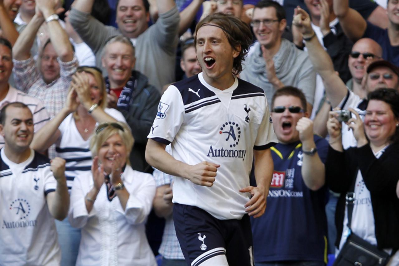'Tottenham Hotspur\'s Croatian midfielder Luka Modric celebrates scoring his goal with supporters during the English Premier League football match between Tottenham Hotspur and Stoke City at White Har