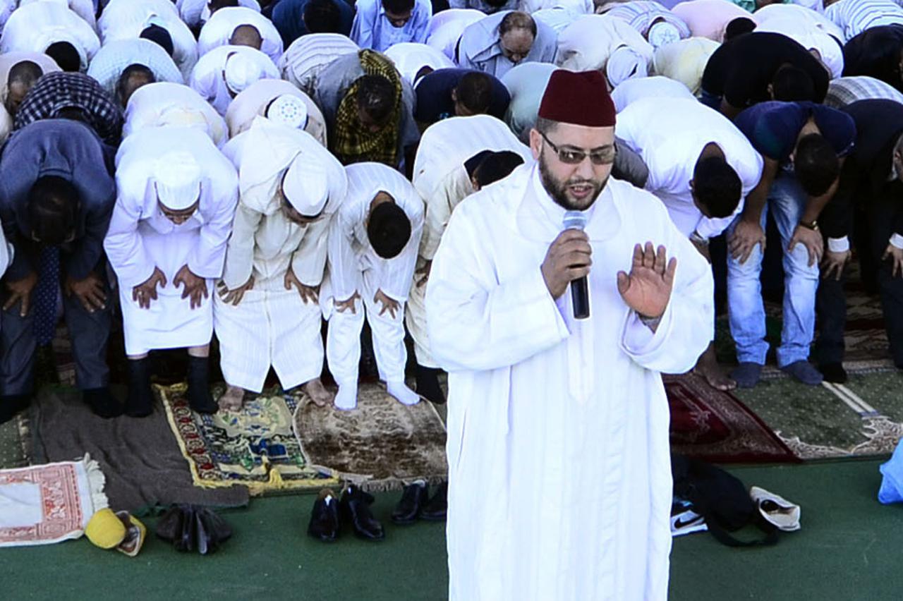 Turin, End of Ramadan prayer. more than 30000 muslims prayed this morning for the end of Ramadan under the canopy of the Ex Teksid  factrory.  