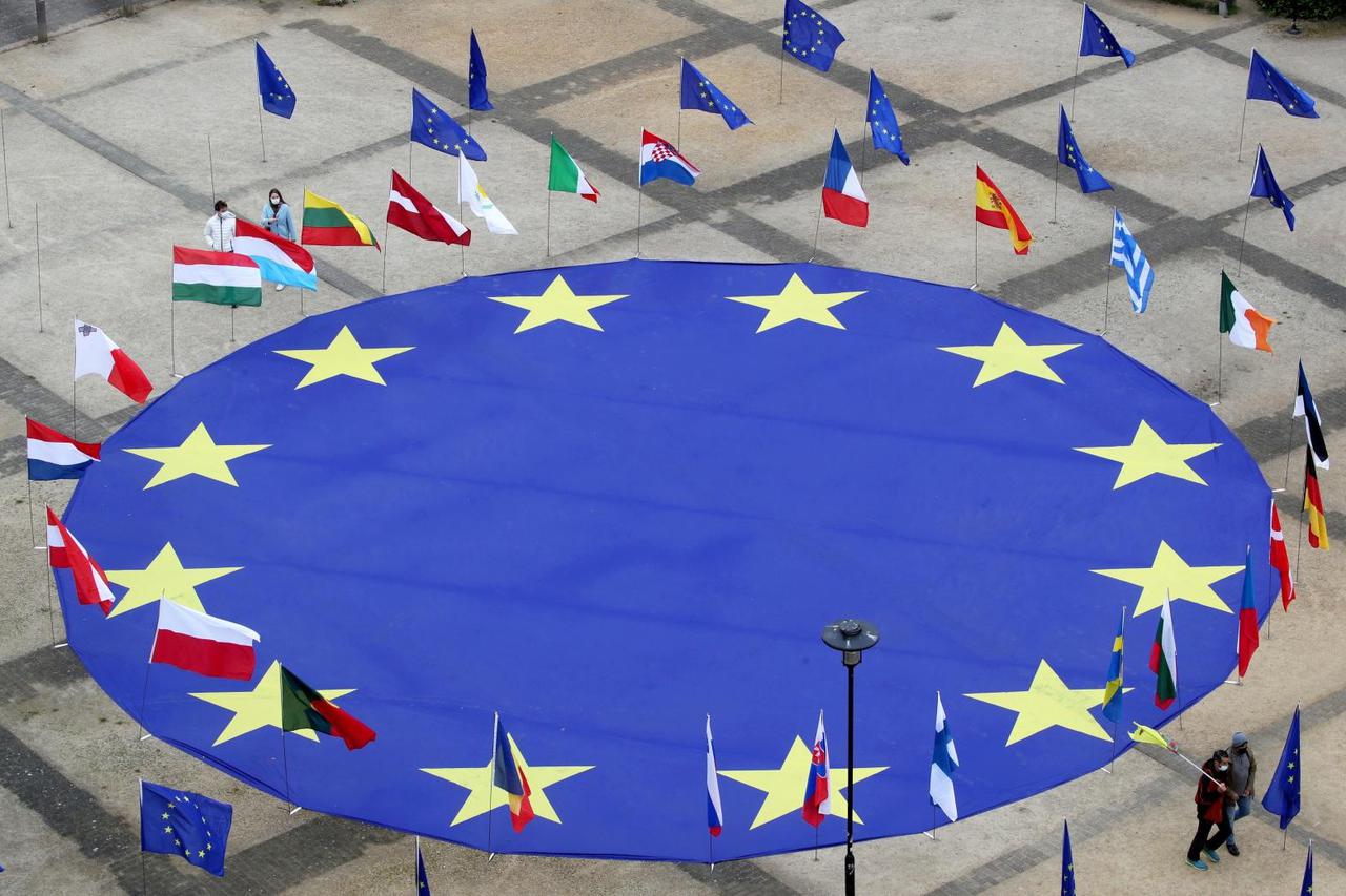 FILE PHOTO: EU flag lies at Schuman square in Brussels