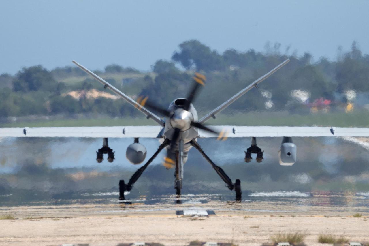FILE PHOTO: Ukrainian servicemen fly with an FPV interceptor drone during their combat shift in Kharkiv region