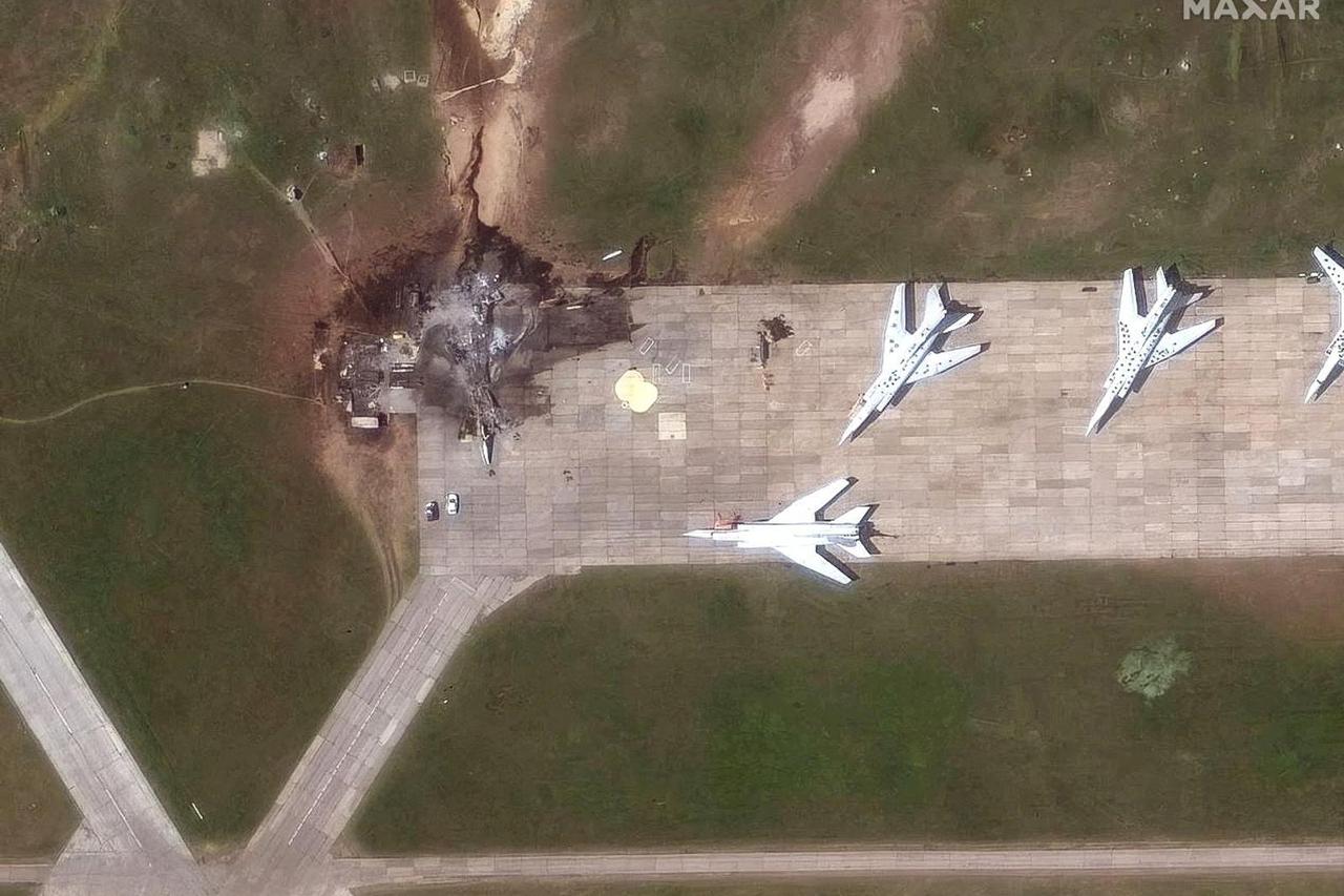FILE PHOTO: A satellite image shows a destroyed TU 22 aircraft in the aftermath of a drone strike at the Belaya air base