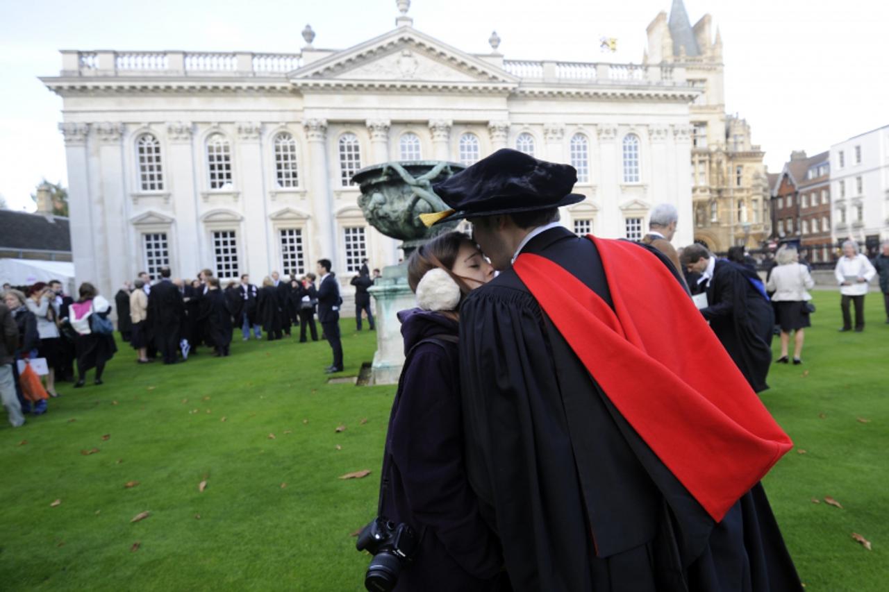 'Graduates gather outside Senate House after their graduation ceremony at Cambridge University in eastern England October 23, 2010. British Deputy Prime Minister Nick Clegg suggested the coalition was