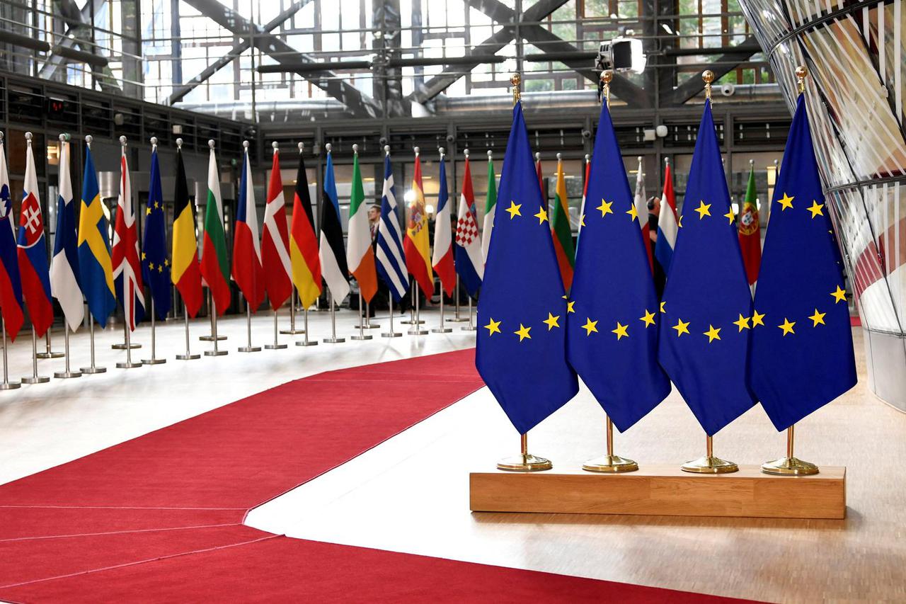 FILE PHOTO: Flags of EU and member states placed for a 2019 summit in Brussels