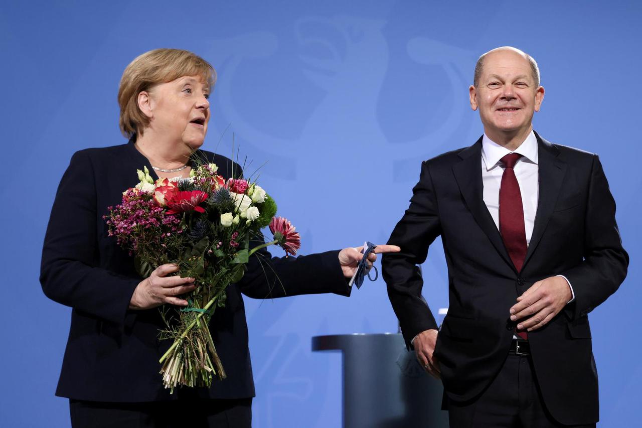 Former German Chancellor Merkel bids farewell to her successor Scholz in Berlin