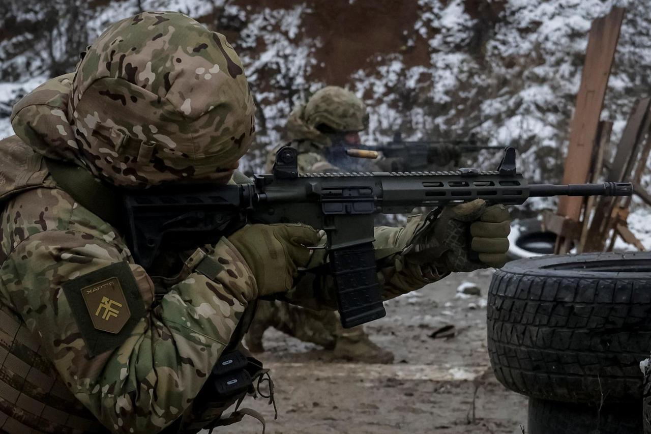 Ukrainian servicemen attend a military exercise between combat missions, in Kharkiv region