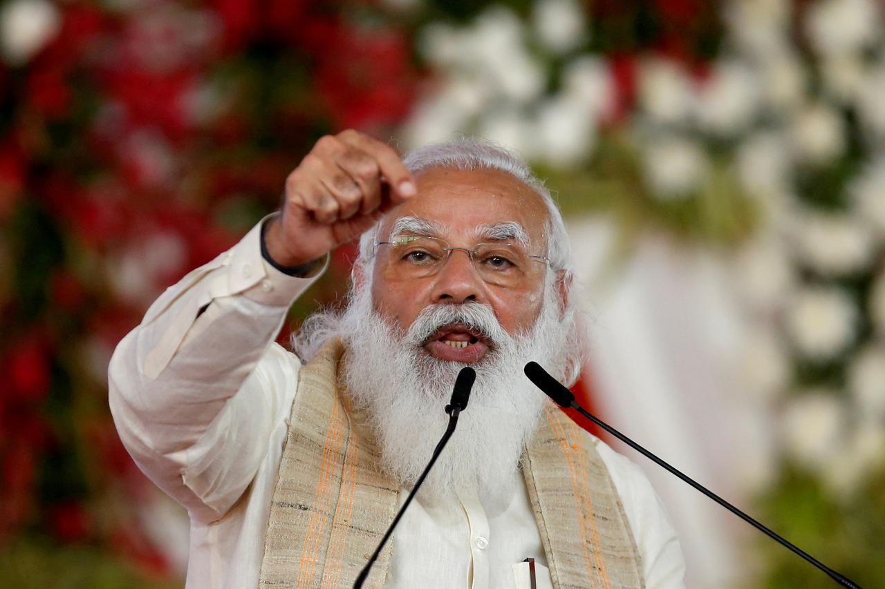 FILE PHOTO: India's PM Modi addresses a gathering before flagging off the "Dandi March", in Ahmedabad