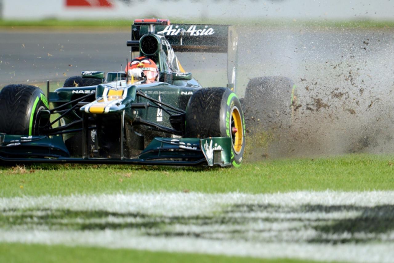 'Caterham - Renault driver Jarno Trulli of Italy slides off the track during the first practice session for Formula One\'s Australian Grand Prix in Melbourne on March 16, 2012.  The opening race of th