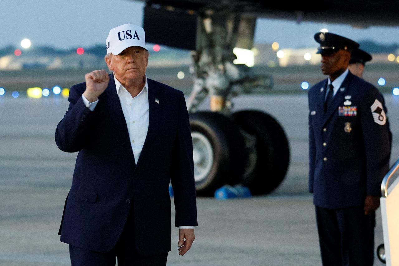 U.S. President Donald Trump steps off Air Force One after arriving at Joint Base Andrews