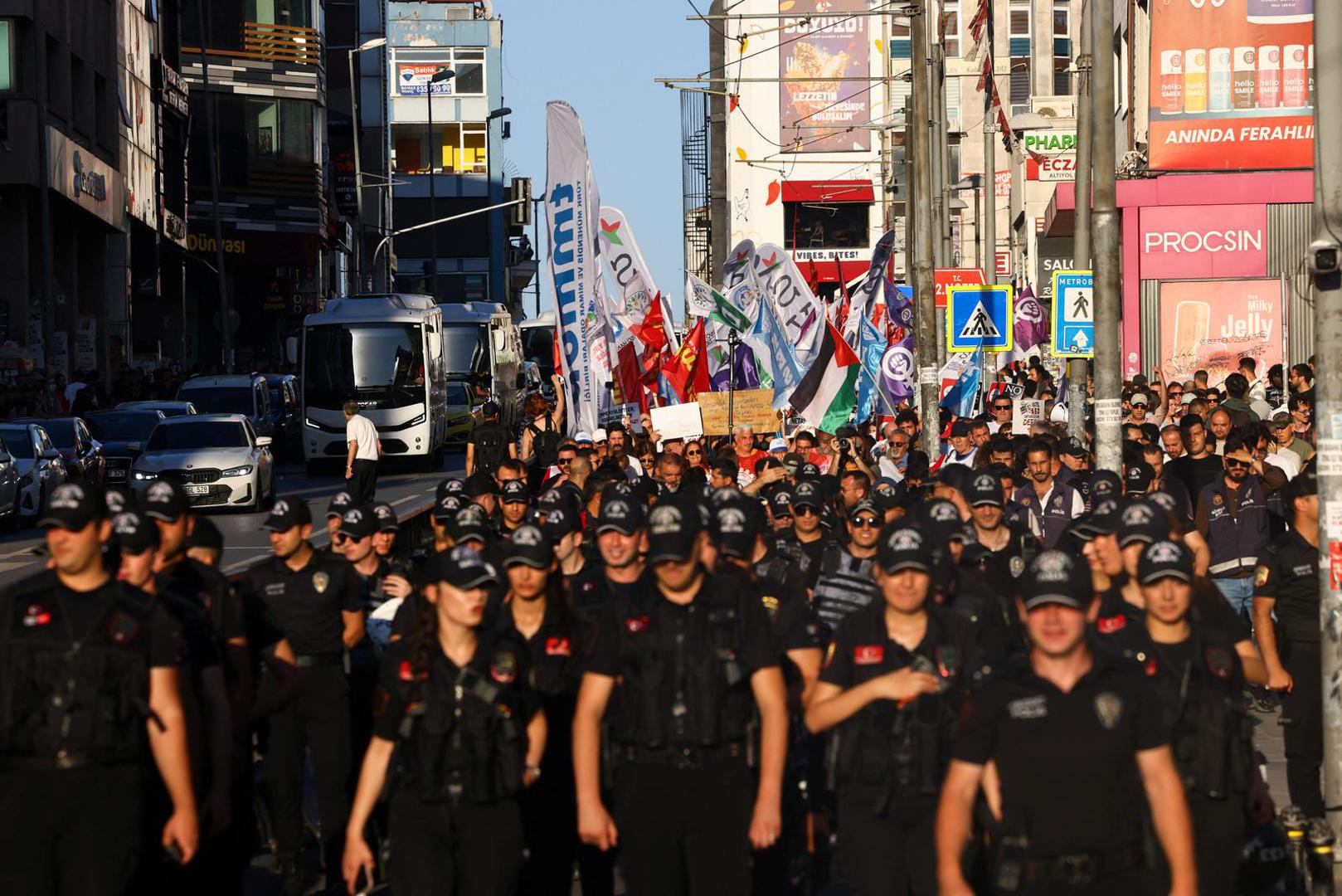 Police officers walk in front of demonstrators holding placards and flags during a protest ahead of NATO leaders' summit, in Istanbul, Turkey, July 5, 2026. REUTERS/Dilara Senkaya Photo: DILARA SENKAYA/REUTERS