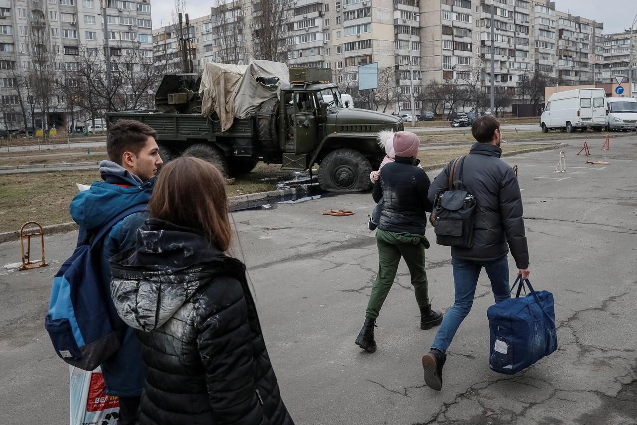People leave Kyiv after Russia launched a massive military operation against Ukraine
