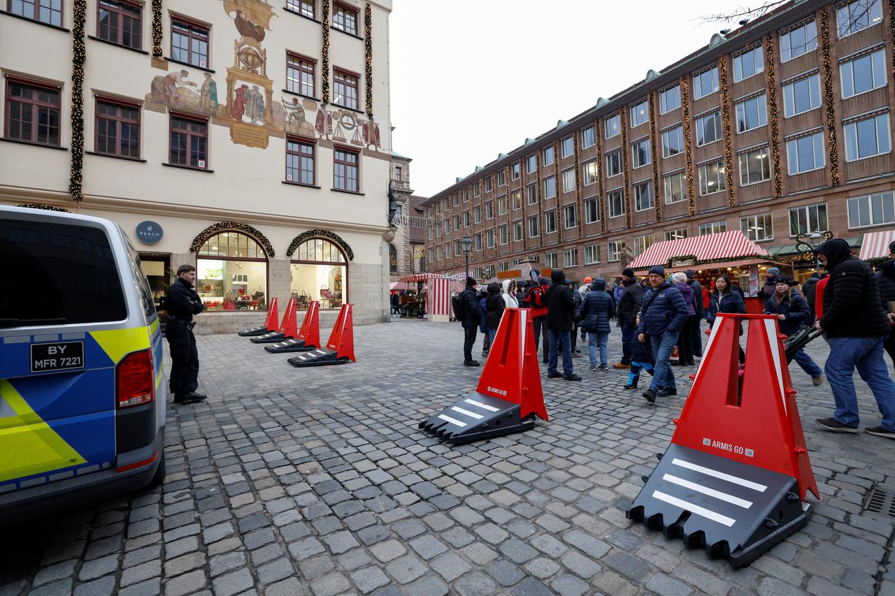 People visit the famous Nuernberger Christkindlesmarkt (Christ Child Market), one of the world's oldest Christmas markets, on the day of its opening ceremony, in Nuremberg