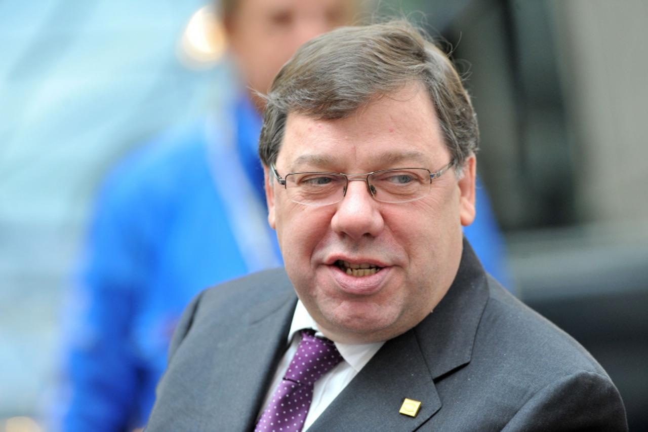 'Irish Prime Minister Brian Cowen leaves after the second day of a European Union summit on October 29, 2010 at the European Council headquarters in Brussels. The European Union faced a new round of r