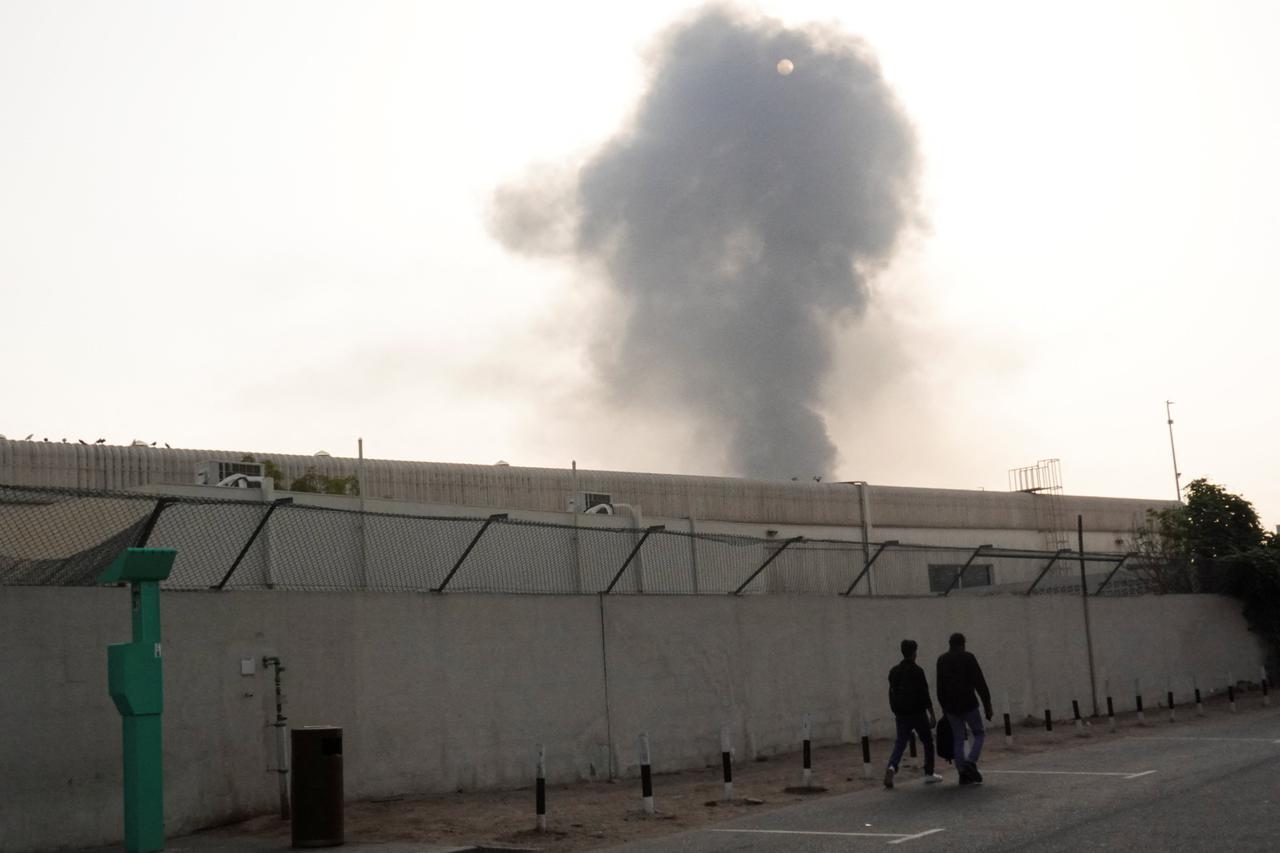 Smoke rises from the Dubai International Airport