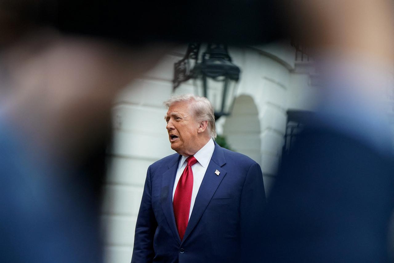 U.S. President Donald Trump talks to reporters at the White House in Washington