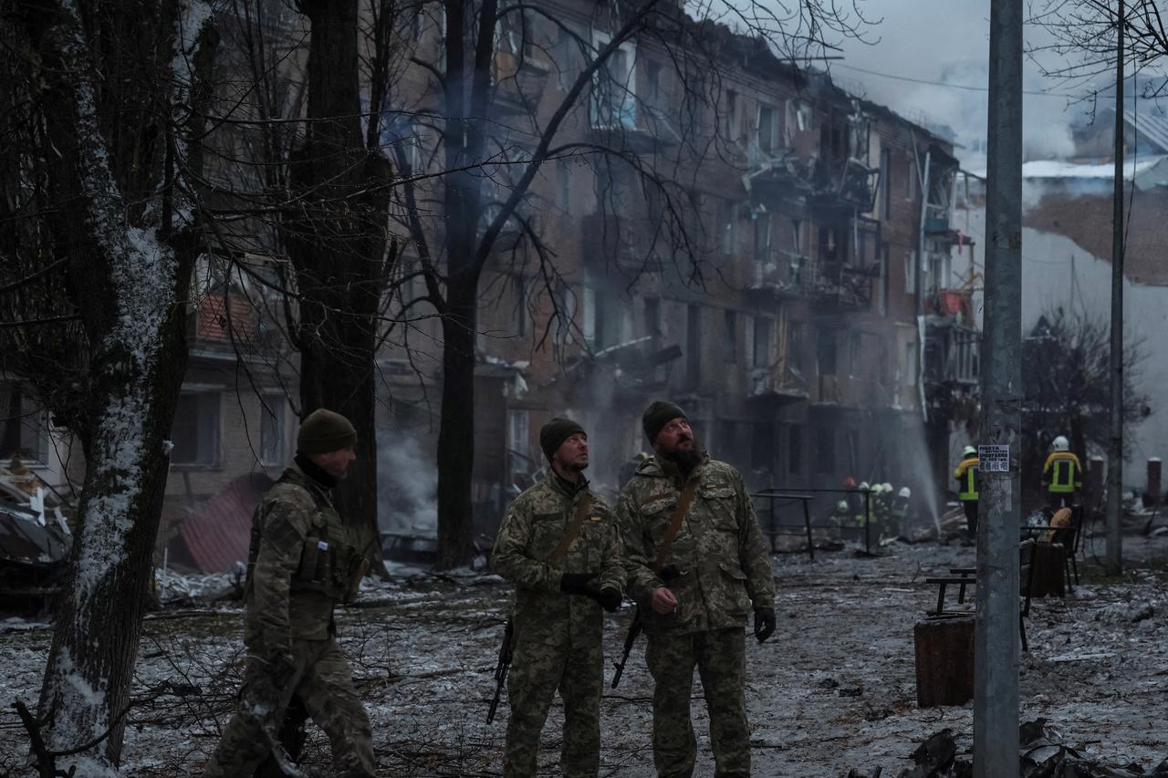 FILE PHOTO: Rescuers work at a site of a residential building destroyed by a Russian missile attack in Vyshhorod