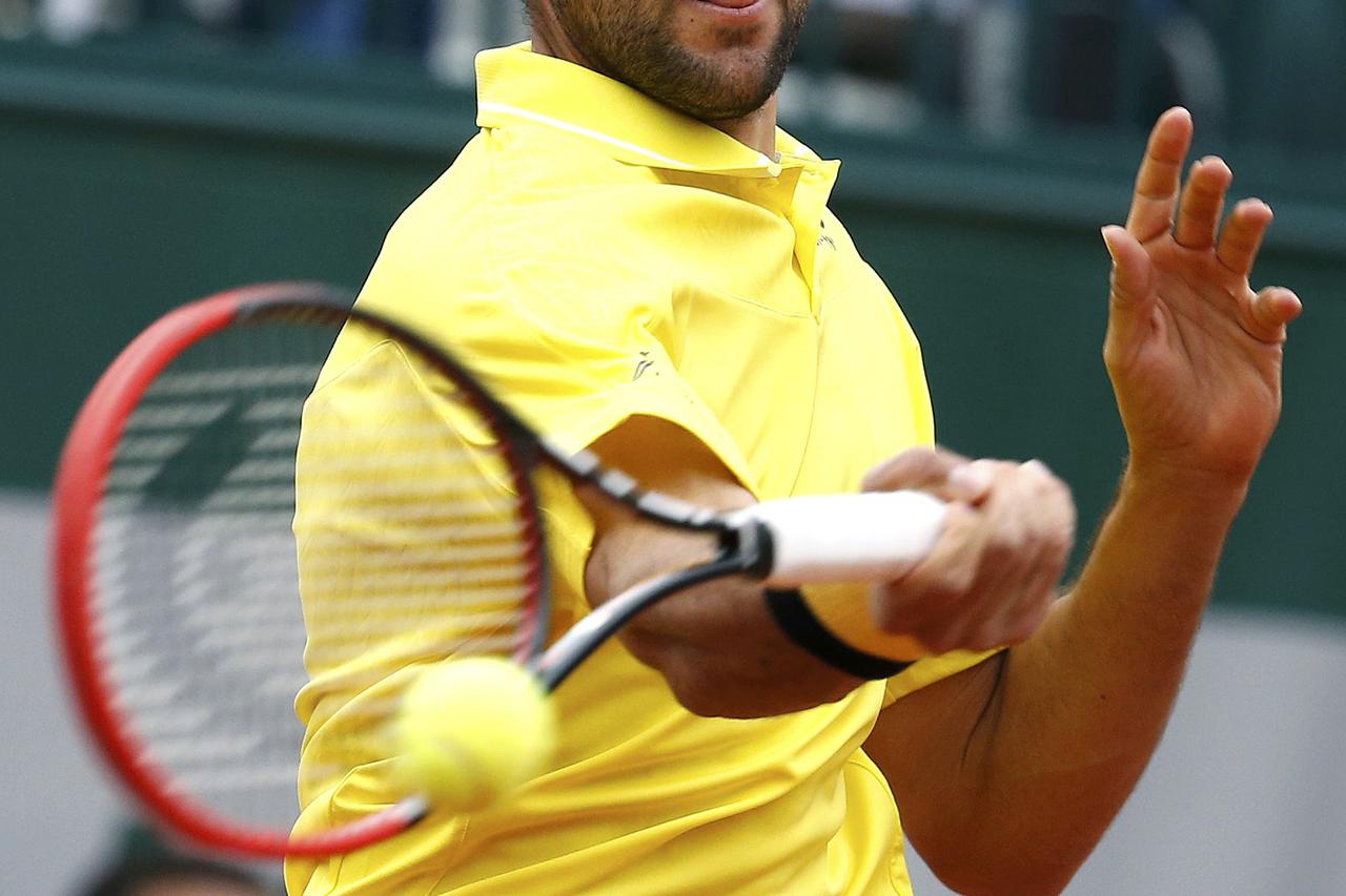 Marin Cilic of Croatia plays a shot to Robin Haase of the Netherlands during their men's singles match at the French Open tennis tournament at the Roland Garros stadium in Paris, France, May 26, 2015.    REUTERS/Vincent Kessler