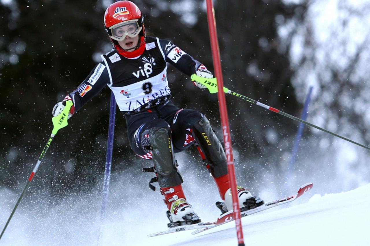 'Ana Jelusic of Croatia clears the pole during the first run of the FIS slalom ski event on mounting Sljeme, some 10 kilometers from capital Zagreb on January 3, 2010.    AFP PHOTO/ PIXSELL'