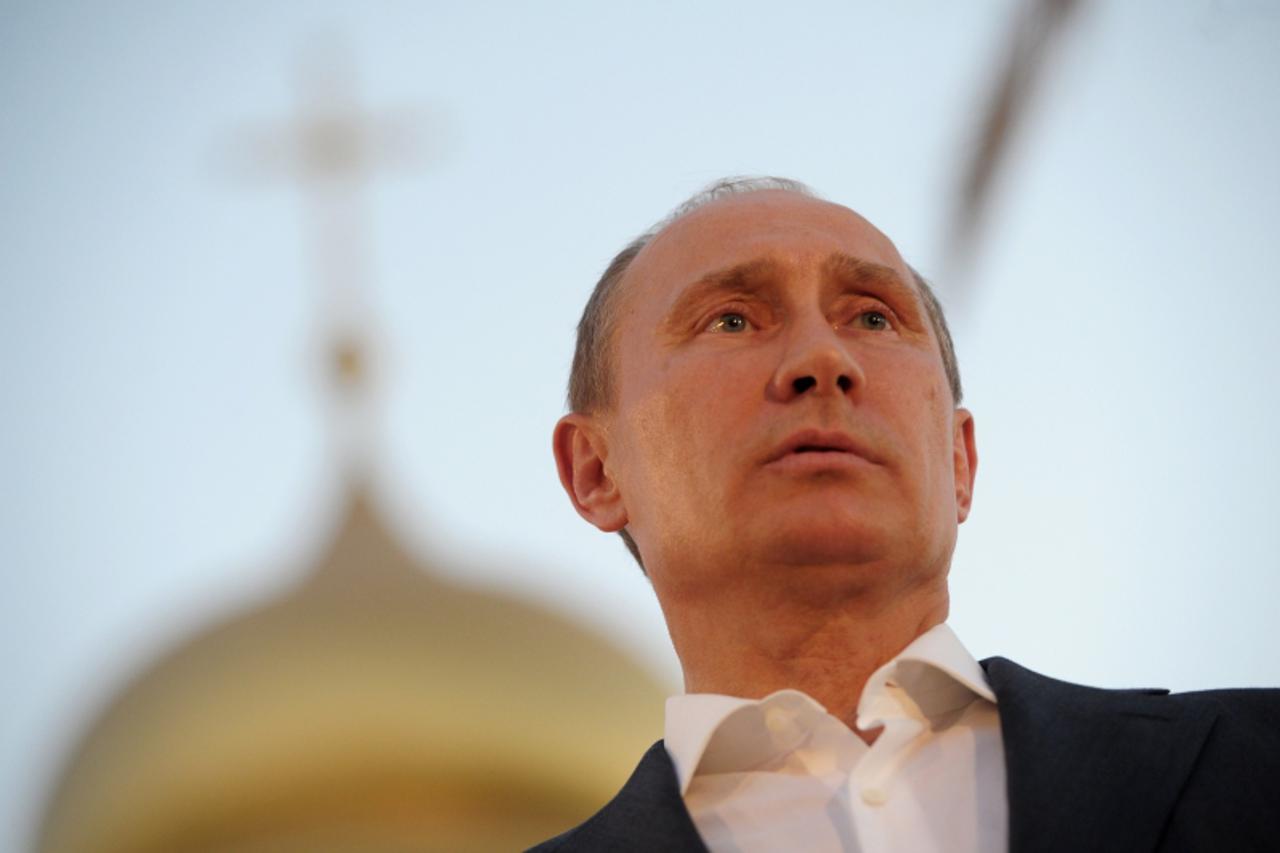 'Russian President Vladimir Putin attends a ceremony to inaugurate a guesthouse for Russia's Christian pilgrims at a Jordan Valley site where many Christians believe Jesus was baptised on June 26, 20